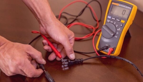 touching the multimeter probes to the motor.