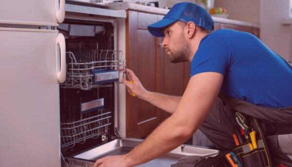 Professional technician inspecting Bosch dishwasher